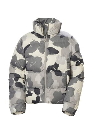 Szürke és krémszínből készült puffermellény, nagyméretű virágmintával, magas gallérral, elülső cipzárral és steppelt textúrával. Puha, szigetelt anyag.