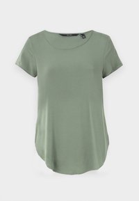 Kurzärmliges T-Shirt mit Rundhalsausschnitt in gedämpftem Grün. Hergestellt aus glattem Stoff mit lockerer Passform und abgerundetem Saum. Keine sichtbaren Muster oder Verzierungen.