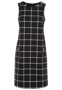 Robe sans manches noir avec un motif à carreaux blancs, encolure ronde, deux poches zippées, coupe ajustée et texture de tissu lisse.