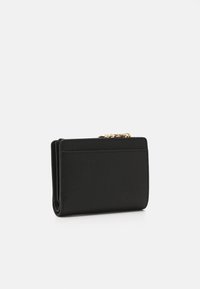 Black leather wallet with textured surface, compact design, featuring a card slot and gold hardware for closure.