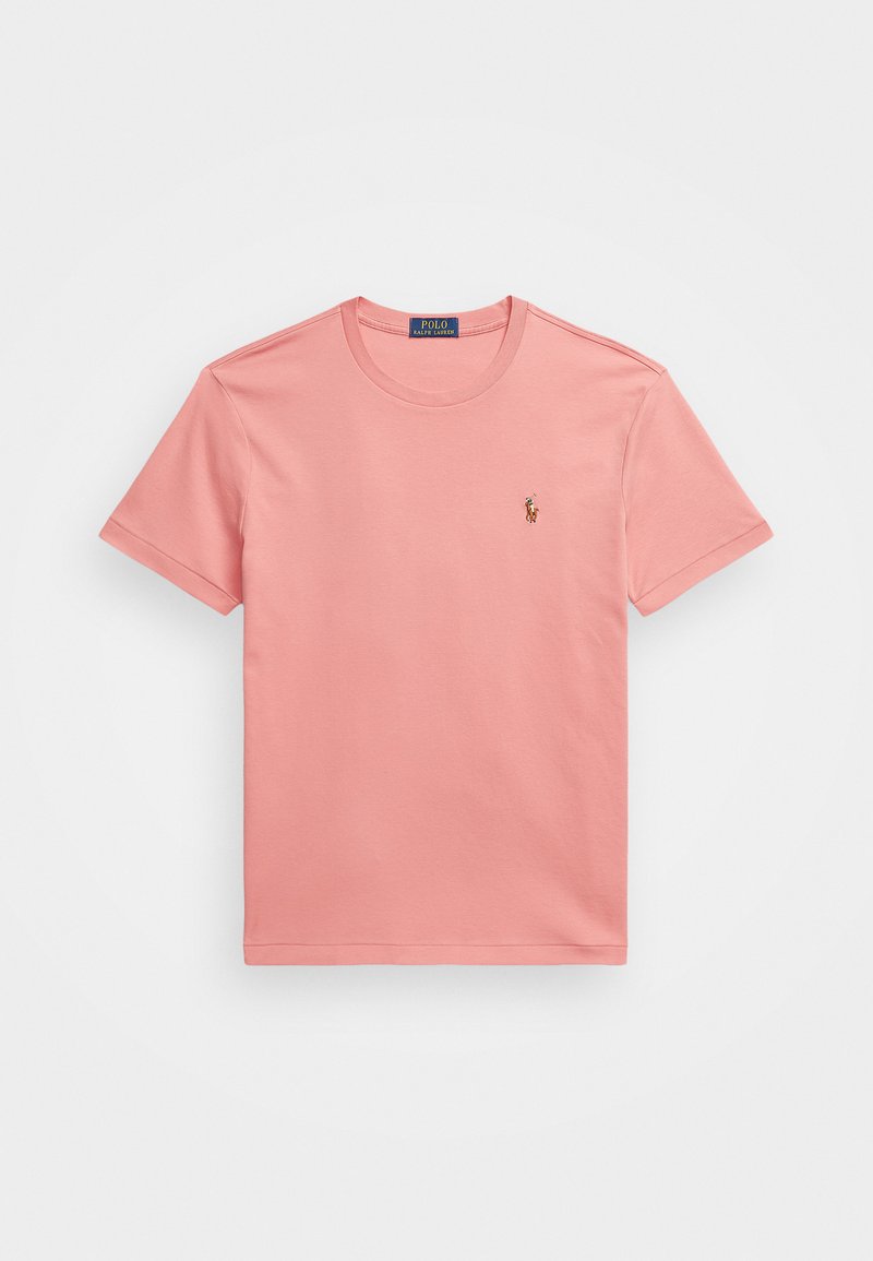 Rosa bomulls t-skjorte med rund hals og korte ermer. Har et lite brodert logo på venstre bryst. Enkel, glatt tekstur.