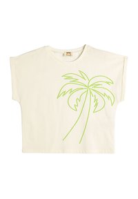Camiseta de color crema con mangas cortas y anchas. Presenta un diseño de palmera con contorno de puntos verdes en la parte delantera. Tejido de algodón suave.