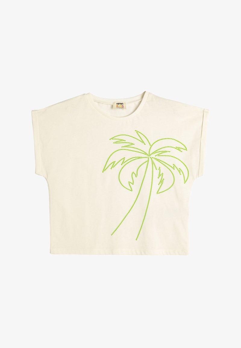 Cremfarbendes T-Shirt mit kurzen, weiten Ärmeln. Auf der Vorderseite befindet sich ein Design einer Palme mit grünem gepunktetem Umriss. Aus weichem Baumwollstoff.