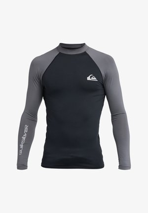 Zwart-grijs rashguard met lange mouwen, voorzien van een gladde textuur, ronde hals en Quiksilver-logo op de borst en mouw.