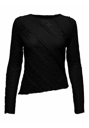 Haut noir à manches longues présentant un tissu texturé avec des coutures diagonales et un ourlet légèrement asymétrique pour un intérêt visuel.