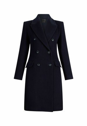 Abrigo de doble botonadura en color navy con un diseño estructurado, solapas en pico, dos bolsillos frontales y botones brillantes. Confeccionado en una tela texturizada.
