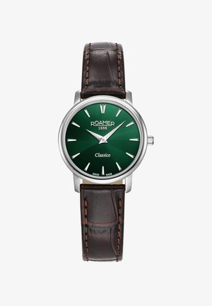 Rund Roamer ur med grøn urskive, sølvkasse og sølv time markeringer. Mørkebrun læderrem med dekorative stikninger.