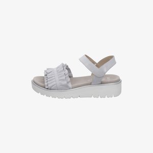 White platform sandal with ruffled front strap and ankle strap, open toe, and textured sole for casual wear.