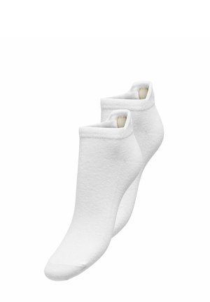 Paire de socquettes blanches unies, invisibles, avec bord-côte replié et petit détail cœur beige à l'intérieur du bord.