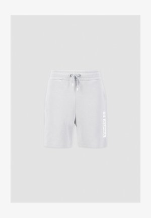 Heledad hallhalli puuvillased lühikesed püksid, millel on elastne vöökoht ja nöör. Vasakul säärel on vertikaalselt prinditud valge logo.