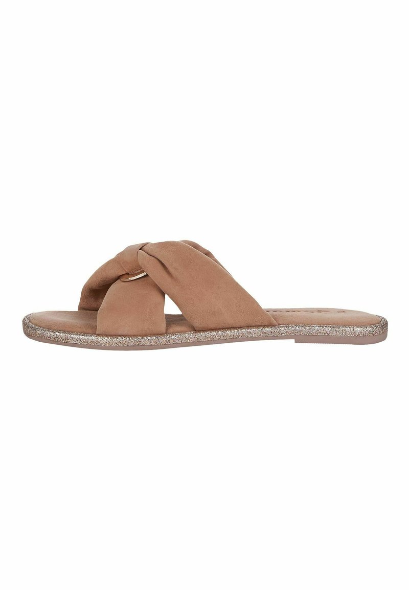 Sandali slide in suede marrone con design annodato, dotati di suola piatta e un bordo argentato scintillante attorno alla base.