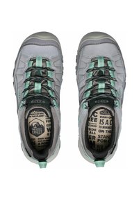 Gray hiking shoes with mesh upper, black laces, and mint green accents. Textured rubber sole and patterned insoles visible.