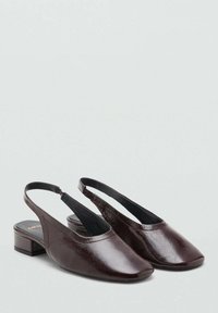 Dark burgundy slingback shoes with a square toe, gloss finish, and low block heel. Smooth texture with a minimalist design.