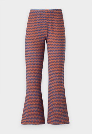 Patterned flared pants featuring a wave design in orange and blue, made of textured fabric with an elastic waistband for comfort.