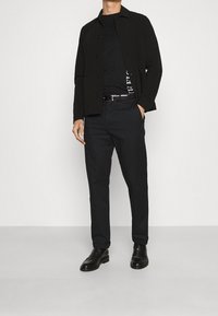 Tommy Hilfiger Triko s potiskem - black