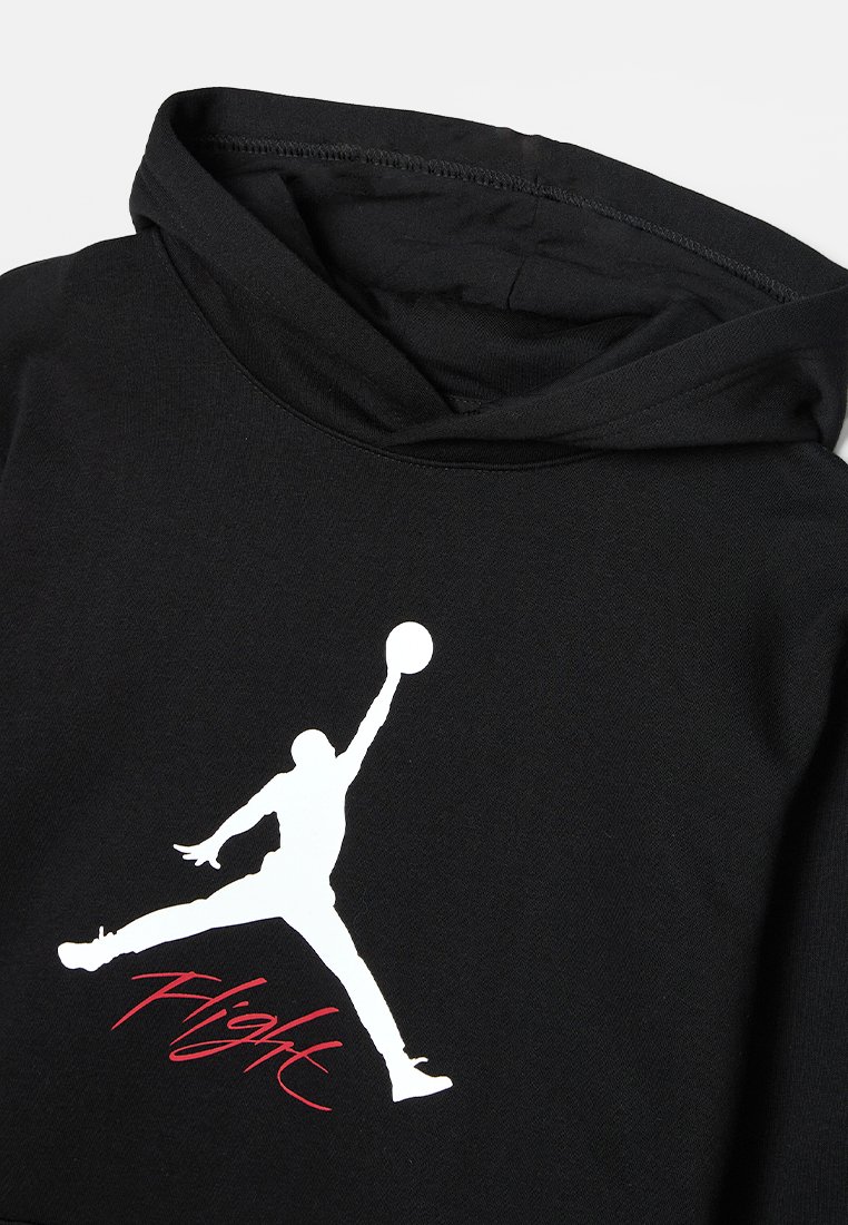 Czarny hoodie z białą sylwetką skaczącej figury i czerwonym napisem "Flight". Miękka tkanina i klasyczny fason z kapturem.