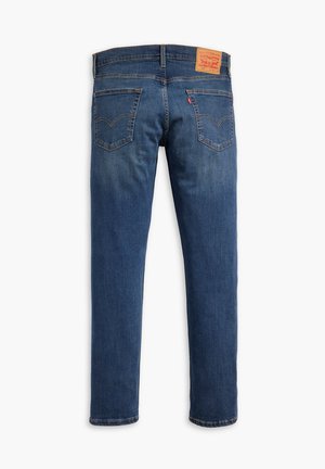Dark blue denim jeans with a straight leg design, five pockets, and a leather patch on the back waistband with brand logo and details.
