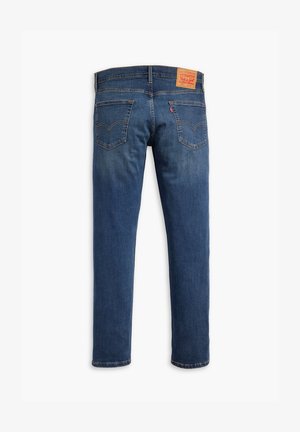 Jeans in denim blu scuro con design a gamba dritta, cinque tasche e una toppe in pelle sulla vita posteriore con logo e dettagli del marchio.