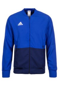 Blaues Zip-up-Jacket mit dunkelblauer Unterseite, gerippten Bündchen und Kragen. Mit weißem Adidas-Logo auf der Brust und Seitentaschen.