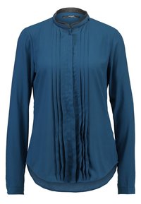 Blusa lunga a maniche, di colore teal, con dettaglio frontale plissettato, orlo curvo e colletto nero. Realizzata in tessuto leggero. Chiusura con bottone al collo.