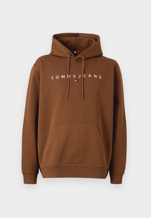 Brūns kapucis izgatavots no kokvilnas, ar priekšējo kabatu, ribotām piedurknēm un kapuci ar aukliņu. "TOMMY JEANS" logo izdrukāts baltā krāsā uz krūšu.