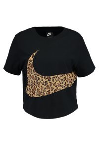 T-shirt cropped nera con un grande logo Swoosh Nike in stampa leopardata. Maniche corte e scollatura rotonda, realizzata in morbido tessuto di cotone.