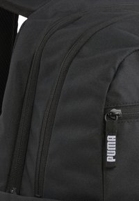 Puma DECK - Nahrbtnik - black