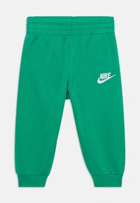 Nike Sportswear REVEAL SET UNISEX - Verryttelypuku - stadium green