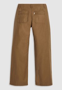 Braune Baumwoll-Twill-Hosen mit geradem Beinverlauf, ausgestattet mit zwei Gesäßtaschen und dezenten Steppnähten. Weicher Stoff, mittlere Leibhöhe.