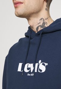 Levi's® RELAXED GRAPHIC - Felpa con cappuccio - blues