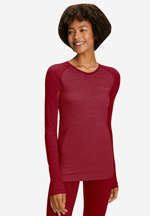 T-shirt de sport à manches longues en bourgogne, présentant un motif texturé. Fabriqué en tissu extensible et respirant, avec une coupe ajustée.