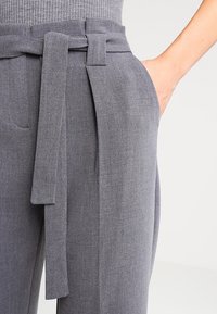 KIOMI Tygbyxor - mottled grey