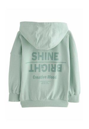 Mintgrøn hoodie med stort, fedt print på ryggen med teksten "SHINE BRIGHT" og "Creative Mood" i kontrastfarver. Blødt stof, løs pasform.