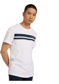 White cotton t-shirt with a round neckline, featuring two navy horizontal stripes across the chest and a logo on the left side.