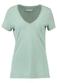 Mintgrön bomulls-T-shirt med V-ringning, korta ärmar och en mjuk, slät textur. Har en etikett vid halsringningen.