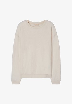 Kremo spalvos ilgomis rankovėmis megztinis su apvalia iškirpte, su ribinėmis rankogaliais ir apačia, pagamintas iš minkštos, tekstūruotos medžiagos.