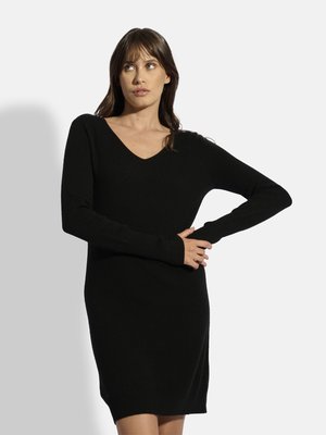 Schwarzes, gestricktes Kleid mit langen Ärmeln und V-Ausschnitt, figurbetontem Schnitt und geripptem Saum. Weiche Textur und Länge bis zur Mitte des Oberschenkels.