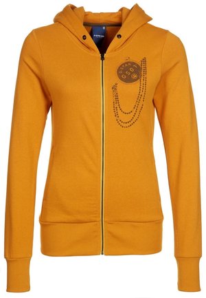 Hořčicově žlutá mikina na zip s kapucí, dlouhými rukávy a černým grafickým potiskem s nápisem "G-Star" a motivem řetězu na hrudi.