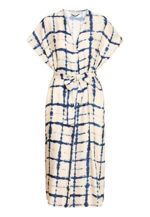 Maxi dress in cream with a navy tie-dye pattern. Features a wrap design, short sleeves, and a belted waist for adjustable fit.