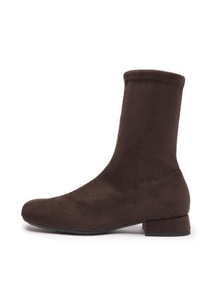 Dark brown suede ankle boot with a low block heel and rounded toe, shown in profile on a white background.