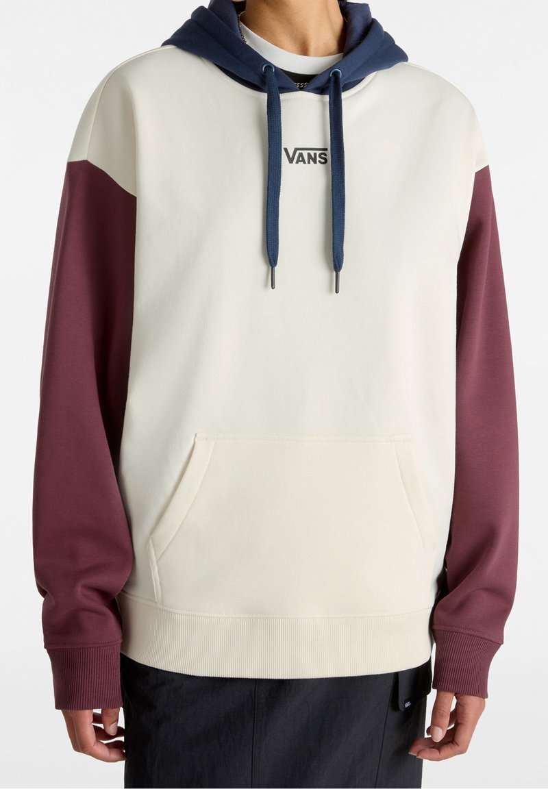 Crewneck sweatshirt with a cream body, burgundy sleeves, and a navy hood. Features a front pocket and Vans logo on the chest.
