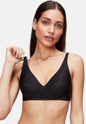 Black seamless wireless bra with a deep V-neck design. Smooth texture, adjustable straps, and no visible hardware details.