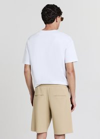 Calliope GINNICO - Pantaloni sportivi - beige