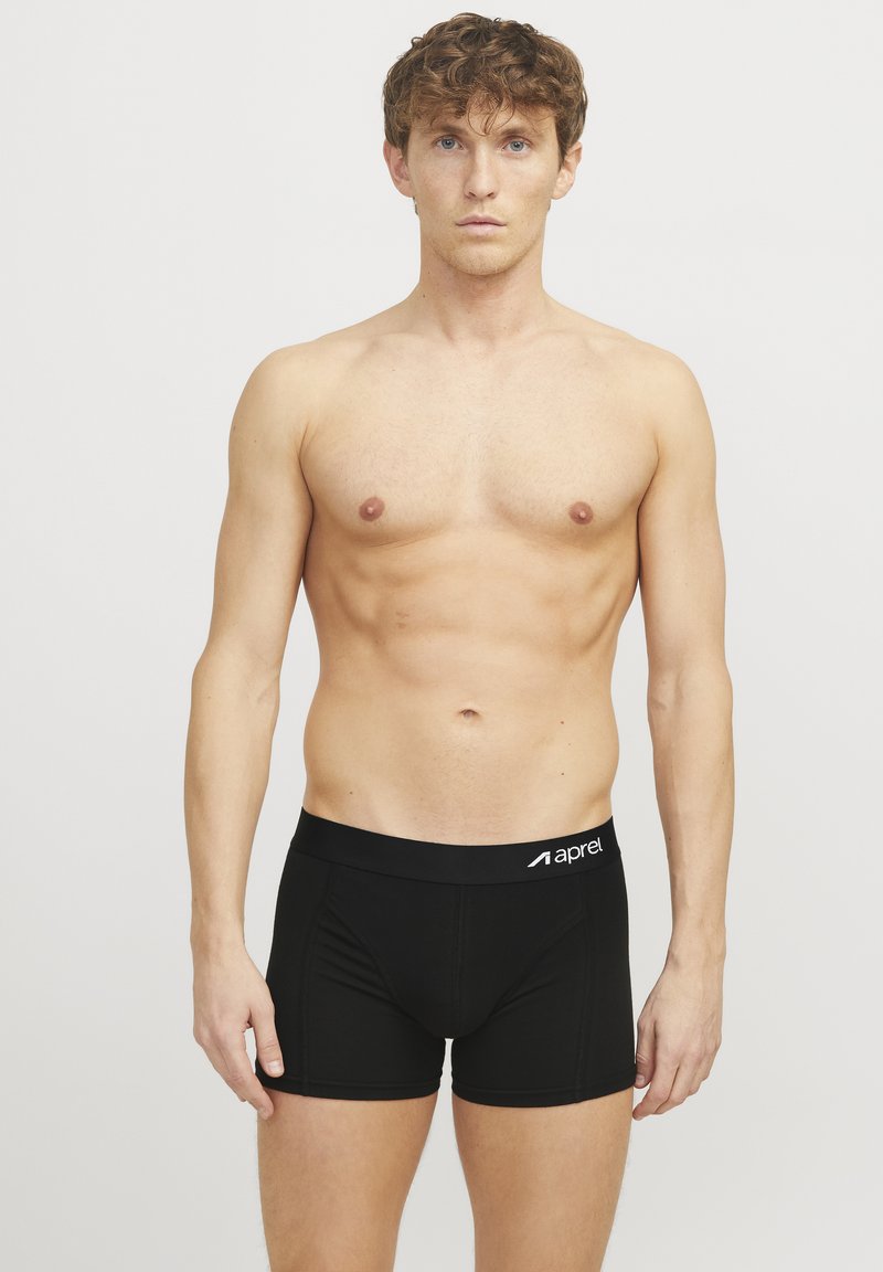 Schwarze Boxer-Briefs aus glattem Stoff mit einem elastischen Bund, auf dem der Markenname "aprel" zu sehen ist. Das Design umfasst einen körpernahen Schnitt und keine Muster.
