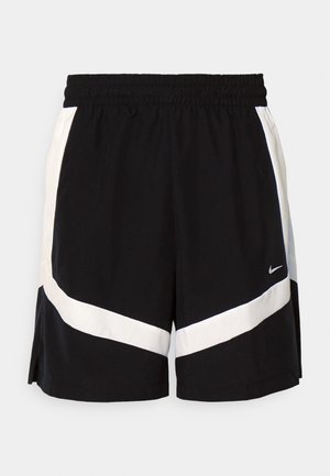 Black athletic shorts with an elastic waistband, featuring white diagonal stripe accents and split side hems. Made from lightweight fabric.