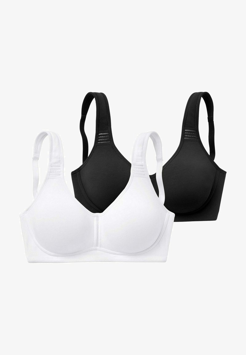 Dva brezžična modrčka v beli in črni barvi. Obe imata gladko, brezšivno zasnovo in nastavljive naramnice za prilagojen fit.