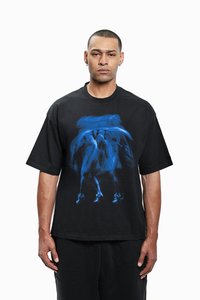 Black oversized t-shirt made of cotton, featuring a blue abstract graphic design on the front. Loose fit with short sleeves and round neckline.