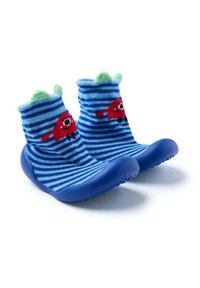 Chaussettes pour tout-petits rayées bleues avec un personnage de bande dessinée rouge, des accents en peluche verte sur le dessus et des semelles en caoutchouc pour une bonne adhérence. Textile doux et extensible.