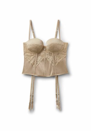 Bustier en dentelle beige avec bonnets à armatures, bretelles réglables, fermeture éclair à l'avant et quatre jarretelles fixées, sur fond blanc.