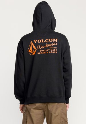 Zwarte hoodie met een oranje grafische print op de achterkant. Gemaakt van katoen, het heeft ribgebreide manchetten en een onderrand. Minimalistisch ontwerp.